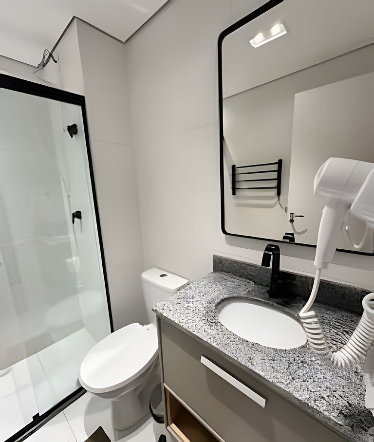 Studio com garagem, piscina e self check-in